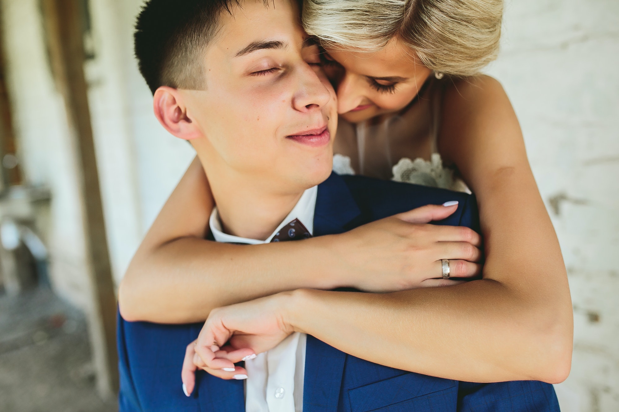 Bride embraces bridegroom